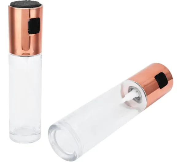 Glasflaska med en olivolja spruta och ett kopparlock